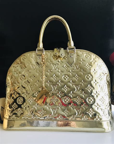 louis vuitton gold alma bag|Louis Vuitton vintage alma bag.